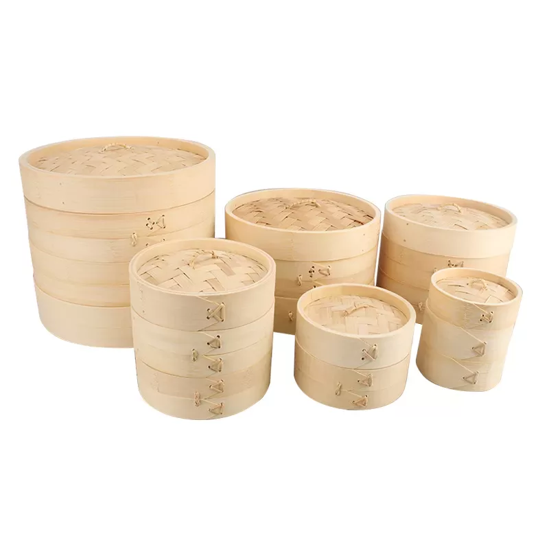 Set of various sized bamboo steamer baskets.