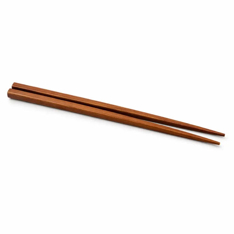 Carbonized bamboo chopsticks set featuring a rich, dark wood tone and precise beveled tips for improved control. A sophisticated variant for modern dining.
