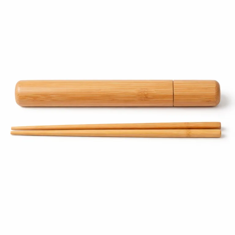 Bamboo chopsticks and carry case in natural, uncoated finish displaying the clean grain pattern of the bamboo. Traditional rounded edges and smooth surface for an understated, eco-friendly aesthetic.
