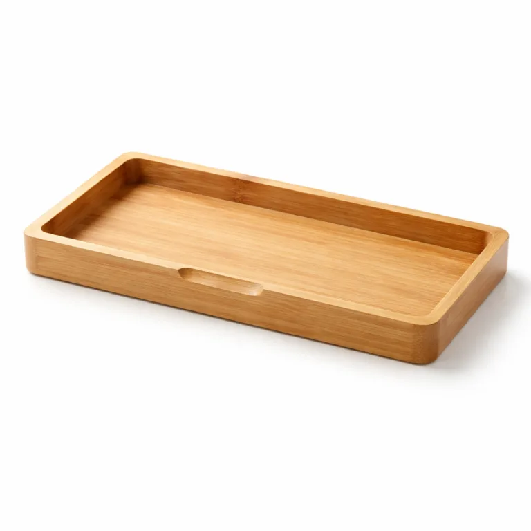 A bamboo desk catchall tray in a matte-oiled finish, highlighted by a subtle finger groove carved into one side for effortless handling. Perfect for desktop essentials.
