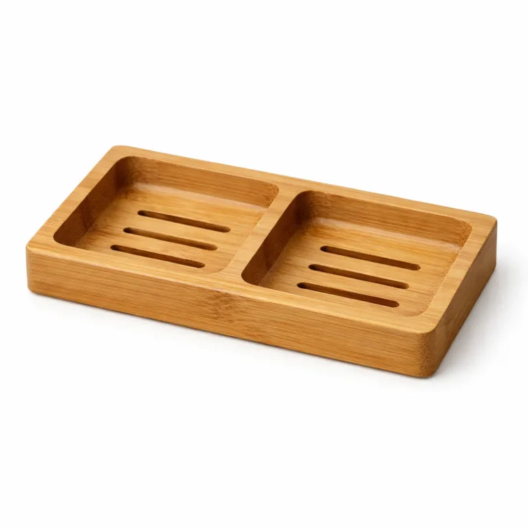 Double soap dish crafted from matte-oiled bamboo, offering a subtle sheen and practical drainage slots for each compartment, helping keep soaps dry and clean.