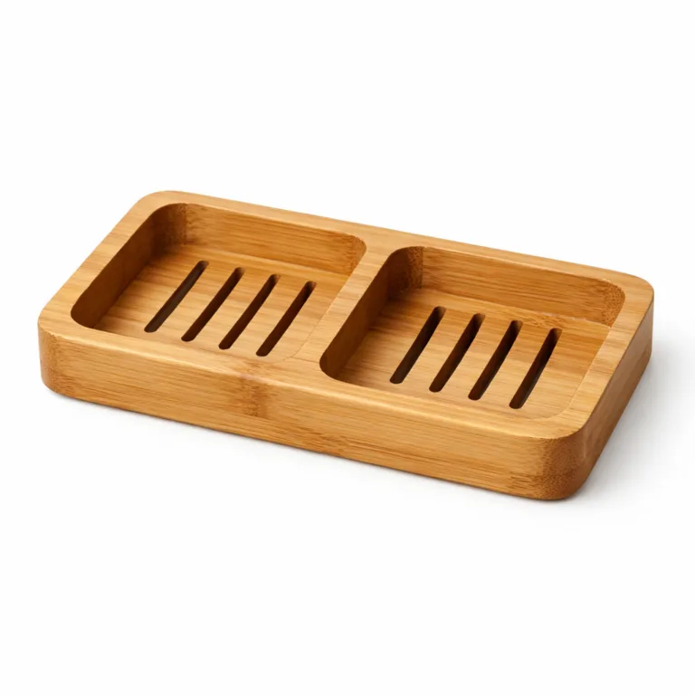 A double-compartment soap dish crafted from natural bamboo, featuring softly rounded edges for a comfortable look and touch. Ideal for modern, minimalist bathrooms.