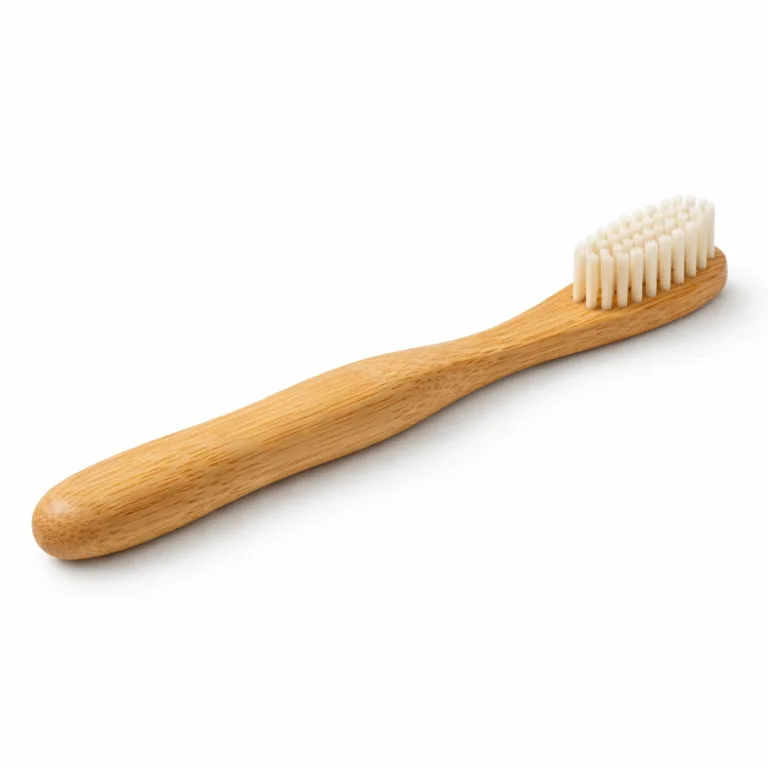A naturally finished Bamboo Ergonomic Handle Toothbrush featuring a rounded-edge design. The smooth bamboo surface and ergonomic shape highlight the product’s comfortable grip and sustainability, perfect for eco-friendly oral care.