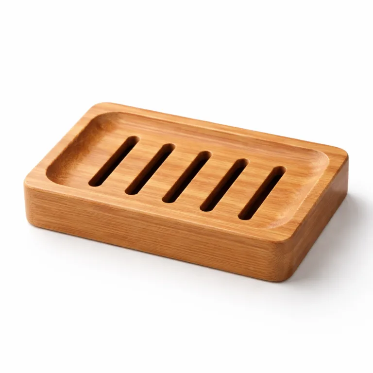 Minimalist soap holder crafted from carbonized bamboo, with distinctive beveled edges and a warm, darker tone. Features a slotted rectangular design to promote drainage and prolong soap life.