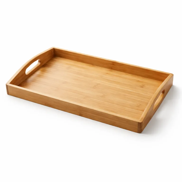 A natural bamboo ottoman serving tray featuring a matte-oiled finish for a refined appearance. The large rectangular tray has softly rounded edges and corners with ergonomic cutout handles, styled for contemporary tabletops.