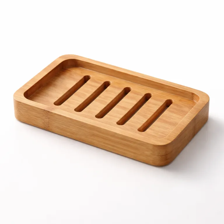 A rectangular moso bamboo soap tray finished in matte oil for a contemporary look, featuring a subtle raised rim around the edge to keep soap in place and multiple drainage grooves for efficient self-draining. Studio photo on white background for e-commerce.