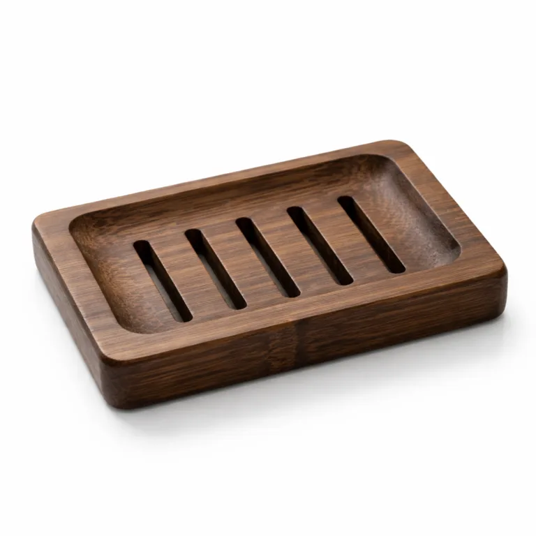 A carbonized dark finish bamboo soap dish for shampoo bars, featuring a rectangular silhouette with subtle beveled edges and functional drainage slots. High-detail image highlights the deep tones and elegant craftsmanship.