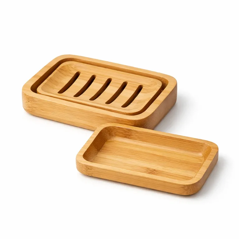 This bamboo soap dish sports gently rounded edges for a softer, modern profile. The removable grooved tray fits inside the smooth rectangular shape, displayed crisply under studio lights.