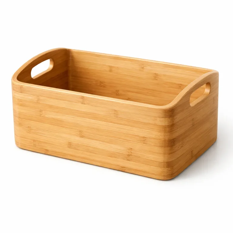 A simple, rectangular bamboo storage basket with smooth, rounded handles and a classic natural bamboo finish. The basket features a soft golden hue, shows off the fine bamboo grain, and is displayed in sharp, bright studio lighting.