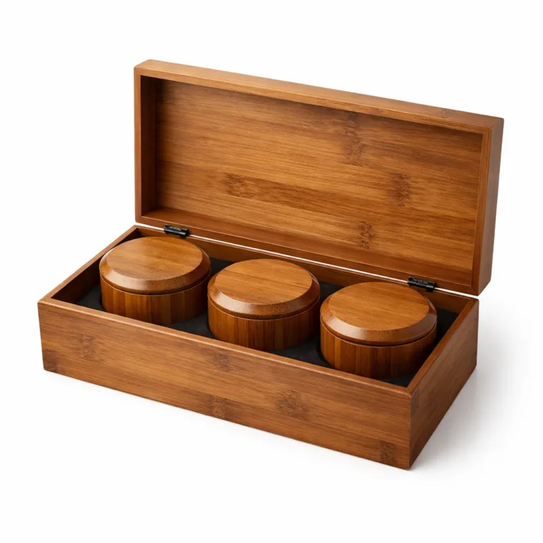 A warm-toned carbonized bamboo tea gift set with round canisters, elevated by beveled lid edges, providing a contemporary and premium look.