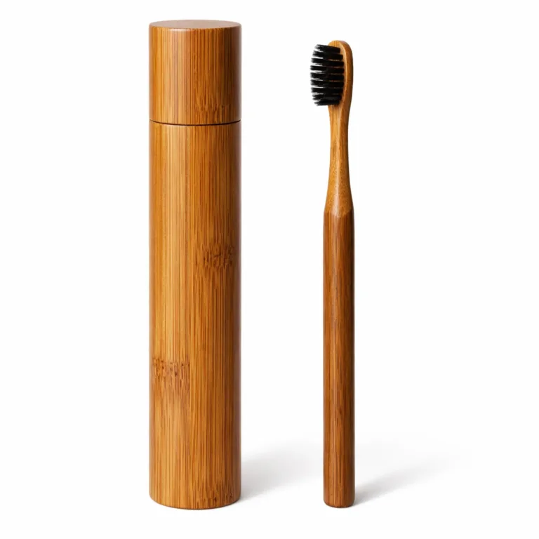 This Bamboo Travel Toothbrush and Case feature a carbonized bamboo finish, displaying rich amber-brown tones from heat treatment. The smooth cylindrical case and toothbrush handle offer a warm, elegant look tailored for eco-conscious travelers.