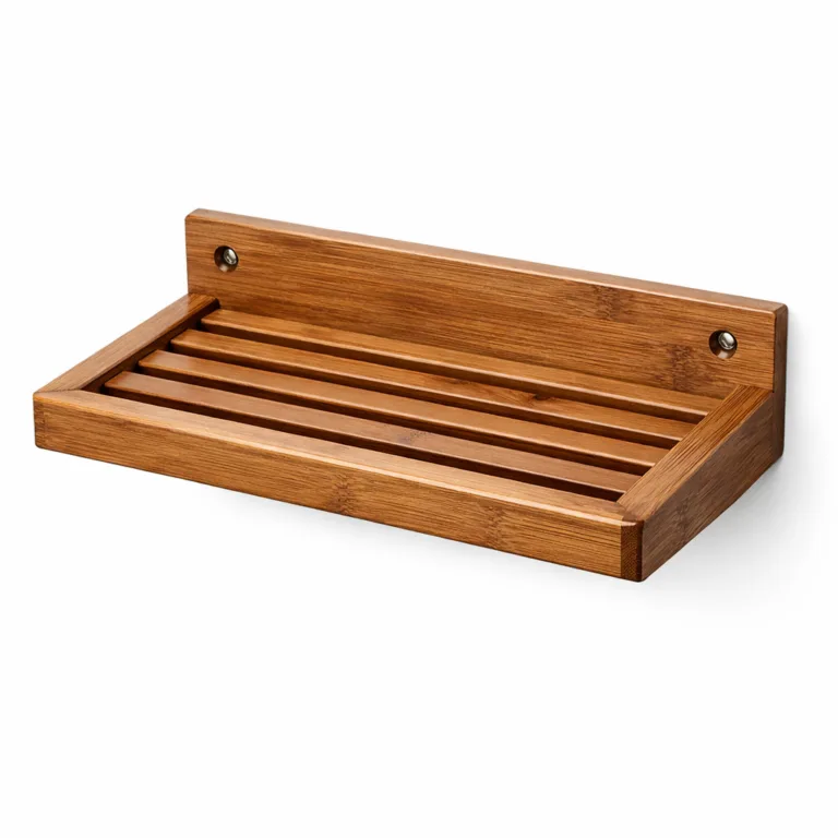 A carbonized bamboo soap shelf featuring a wall-mount design with meticulously beveled edges and a sleek, slatted surface, highlighted under commercial studio lighting.