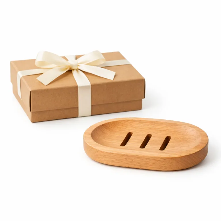 A wooden soap dish gift set featuring an oval beech wood soap dish with a matte-oiled surface and smoothly beveled edges. Packaged attractively in a matching gift box.