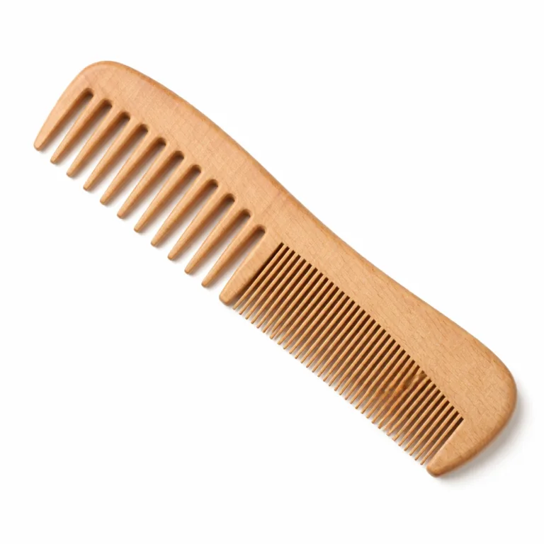 Ergonomically designed wooden comb made from beech wood, featuring a subtle matte-oiled finish for extra grip and a sculpted handle for comfortable everyday use. Perfect for e-commerce product visuals.