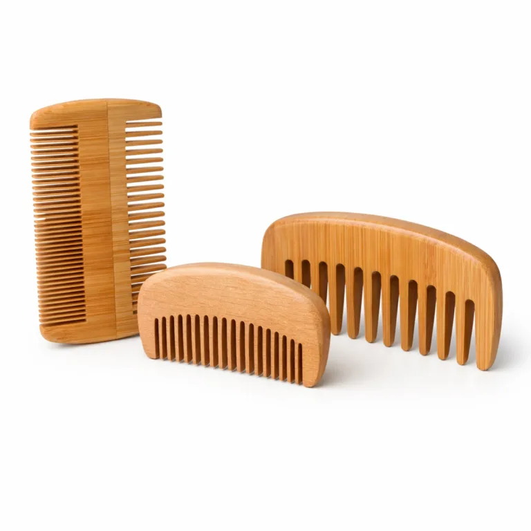 A three-piece grooming comb set, crafted from natural bamboo and beech wood. Each comb features gentle curves, distinct tooth patterns, and a smooth matte-oiled finish for a silky touch, displayed on a sharp white studio background.