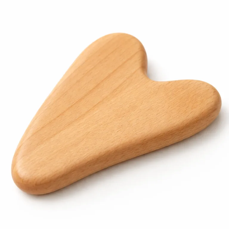High-resolution image of a heart-shaped beech wood gua sha massager, featuring a smooth natural finish and ergonomically rounded edges for comfortable massage. Captured in a professional studio with a crisp white backdrop for e-commerce display.