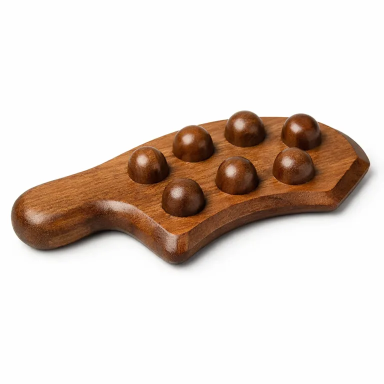 A carbonized beech wood lymphatic massage tool with a subtly dark finish, ergonomic handle and distinctive beveled edge profile, showcased in a sharp e-commerce studio image.