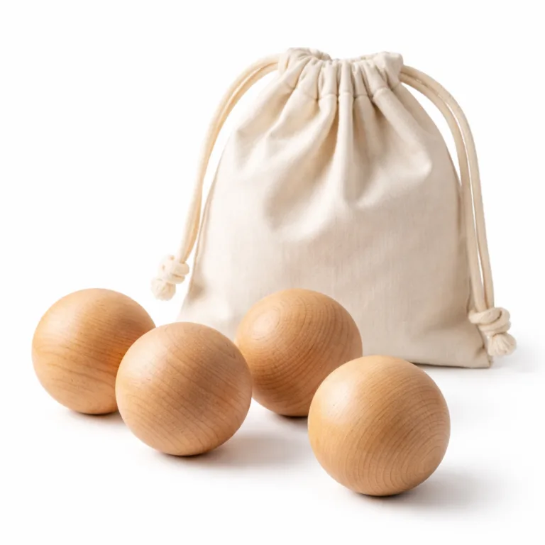 A set of four natural beech wood massage balls, each featuring gently rounded edges for comfortable use. Includes a minimalist cotton pouch. Displayed clearly for e-commerce.
