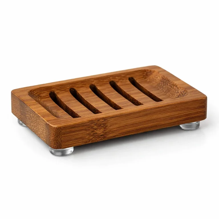 A soap dish made from carbonized bamboo in a rich brown tone, featuring extra drainage slots and a thicker profile for durability. Four silicone feet are clearly visible for secure placement.