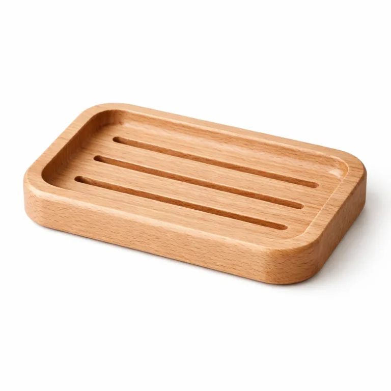 A beech wood soap dish designed with a subtle raised rim surrounding the top and deep drainage grooves, preventing water overflow for neat countertops.