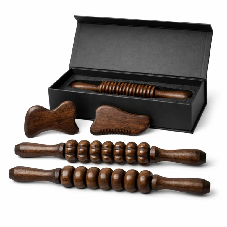 A Wooden Spa Massage Tool Set in deep carbonized beech, featuring roller sticks with ergonomic beveled-edge handles and gua sha tools for enhanced style. The set comes in an elegant gift box, designed for e-commerce photography.